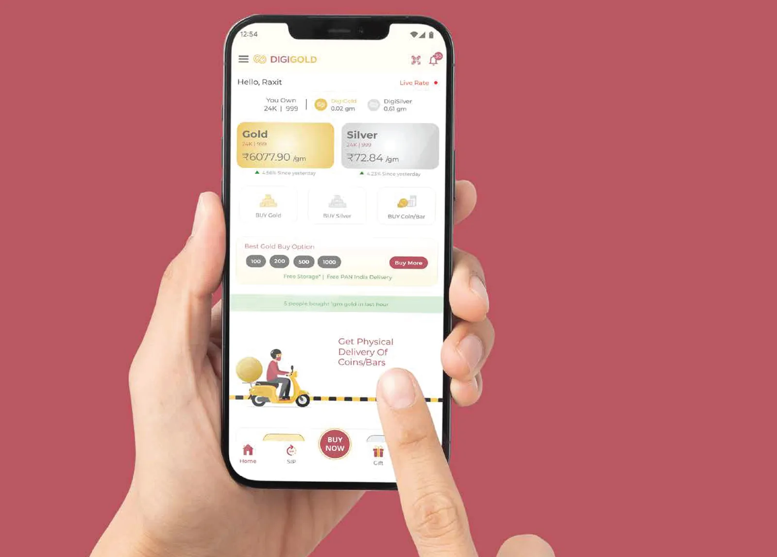 DigiGold mobile app shown in a hand